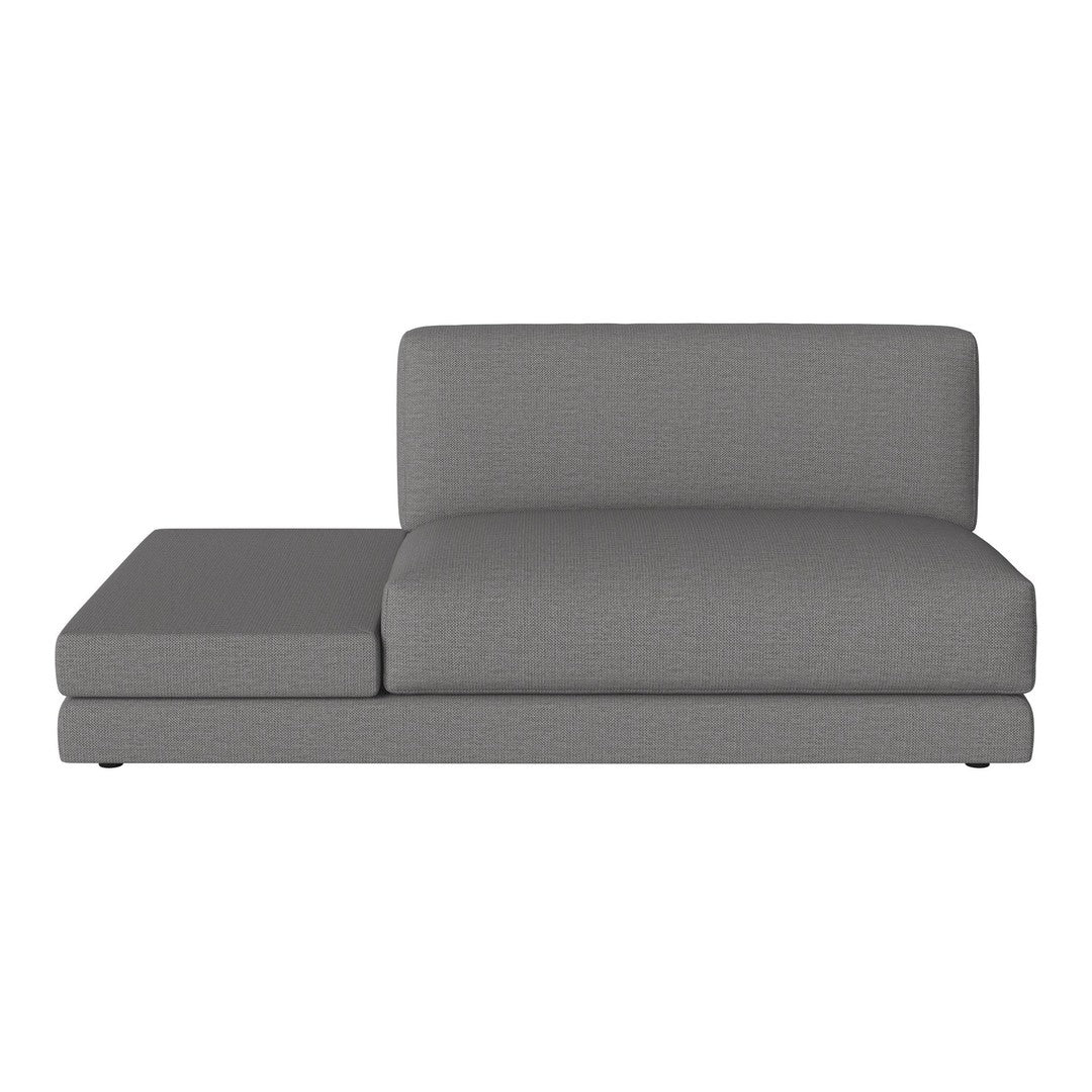 Modern gray chaise lounge with a sleek, textured fabric and minimalist design, perfect for contemporary decor.