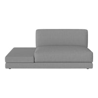 Modern gray chaise sofa with a minimalist design and textured fabric. Perfect for contemporary living spaces.