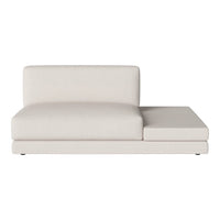 Modern beige sofa with a sleek, minimalist design and a single seat cushion. Soft fabric with no patterns.