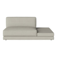 Beige upholstered chaise lounge with a minimalist design and smooth, contemporary lines. Perfect for modern decor.