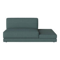 Teal upholstered chaise lounge with a minimalist design and textured fabric pattern for modern living spaces.