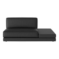 Stylish black leather sectional sofa with a sleek, minimalist design and smooth upholstery. Perfect for modern interiors.