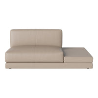 Beige leather sectional sofa with a smooth matte finish and clean lines, perfect for modern living spaces.