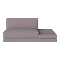 Gray sectional sofa with a sleek, minimalist design and smooth upholstery. Ideal for modern living spaces.