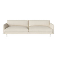 Cream-colored sofa with a smooth, minimalist design and no patterns, featuring clean lines and sleek metal legs.
