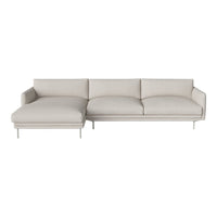 Light beige sectional sofa with a sleek design, featuring a smooth fabric texture and minimalist metal legs.