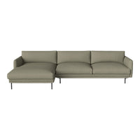 Olive green sectional sofa with a minimalist design and smooth fabric, featuring plush cushions and sleek metal legs.