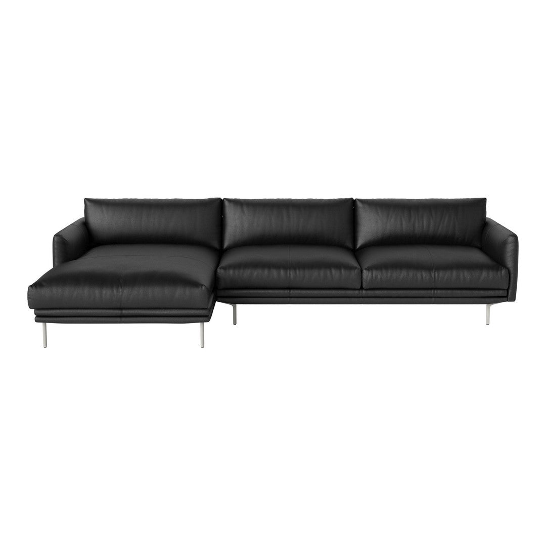 Black leather sectional sofa with sleek lines and a modern design, featuring a minimalist aesthetic.