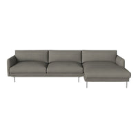 Modern grey sectional sofa with clean lines and a minimalist design, featuring soft upholstery and metal legs.
