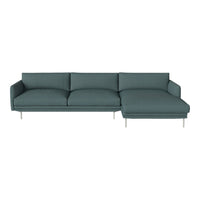 Teal fabric sectional sofa with smooth texture and minimalist design, featuring soft, plush cushions.