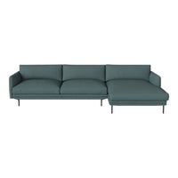 Teal modern sofa with sleek lines and subtle textured fabric, featuring a chaise lounge and minimalist metal legs.