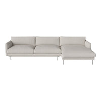Light gray sectional sofa with smooth fabric and minimalist design, featuring soft, plush cushions and sleek metal legs.