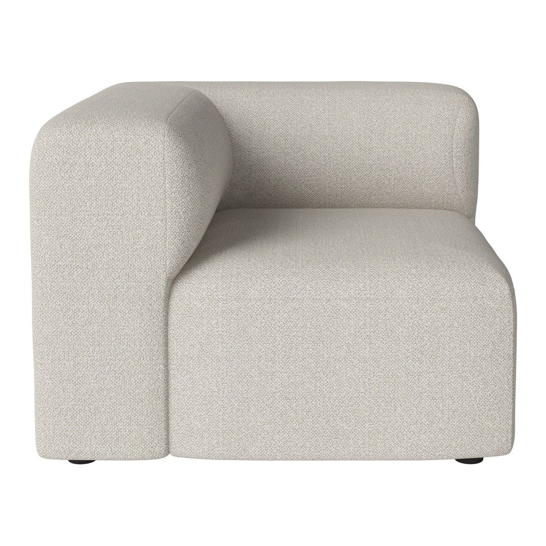 Beige modular couch with a textured fabric pattern and rounded armrest design. Perfect for contemporary living spaces.