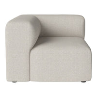 Beige modular couch with a textured fabric pattern and rounded armrest design. Perfect for contemporary living spaces.