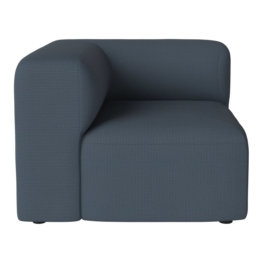 Dark blue ribbed fabric corner chair with a modern, minimalist design. Ideal for contemporary settings.