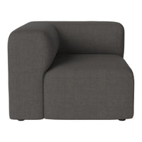 Gray fabric upholstered corner chair with a smooth, minimalist design and subtle texture. Perfect for modern interiors.
