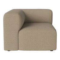 Beige upholstered corner chair with soft, rounded edges and a textured fabric finish, perfect for modern decor.