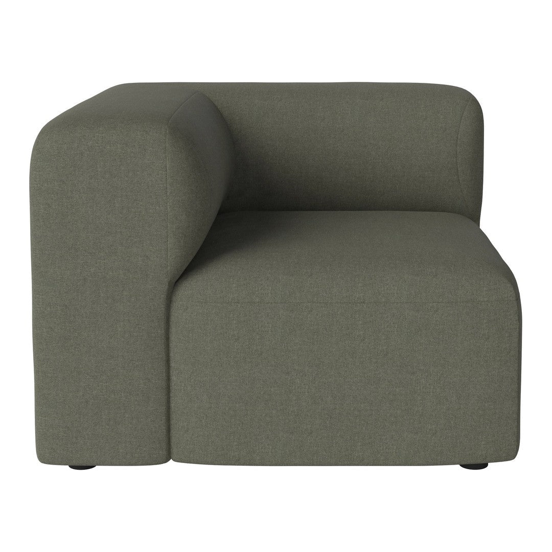 "Modern green corner sofa with a textured, fabric finish and minimalist design."