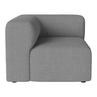 Gray fabric armchair with a modern, geometric design and soft, smooth texture. Perfect for contemporary interiors.