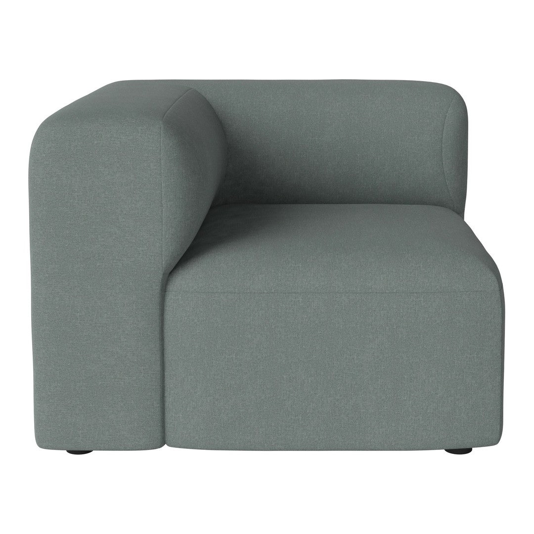 Soft gray upholstered corner chair with a modern, minimalist design and clean lines. 