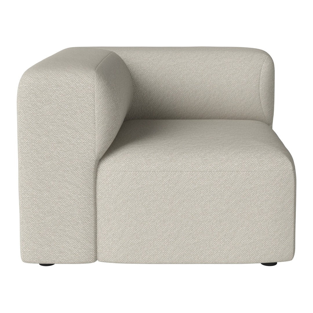 Soft beige corner chair with a smooth, textured surface and minimalist design, perfect for modern interiors.
