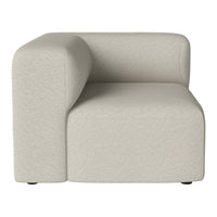 Soft beige corner chair with a smooth, textured surface and minimalist design, perfect for modern interiors.
