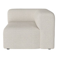 Cream-colored upholstered modular sofa with a smooth, minimalist design and subtle textured pattern.