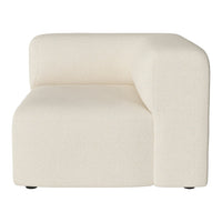 "Modern cream-colored fabric sofa with a minimalist design and textured surface."