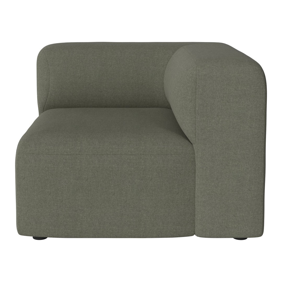 "Modern green sofa corner unit with a smooth, textured fabric and rounded armrest design."
