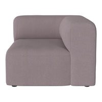 Soft gray corner chair with a minimalist design and smooth fabric texture. Ideal for modern living spaces.