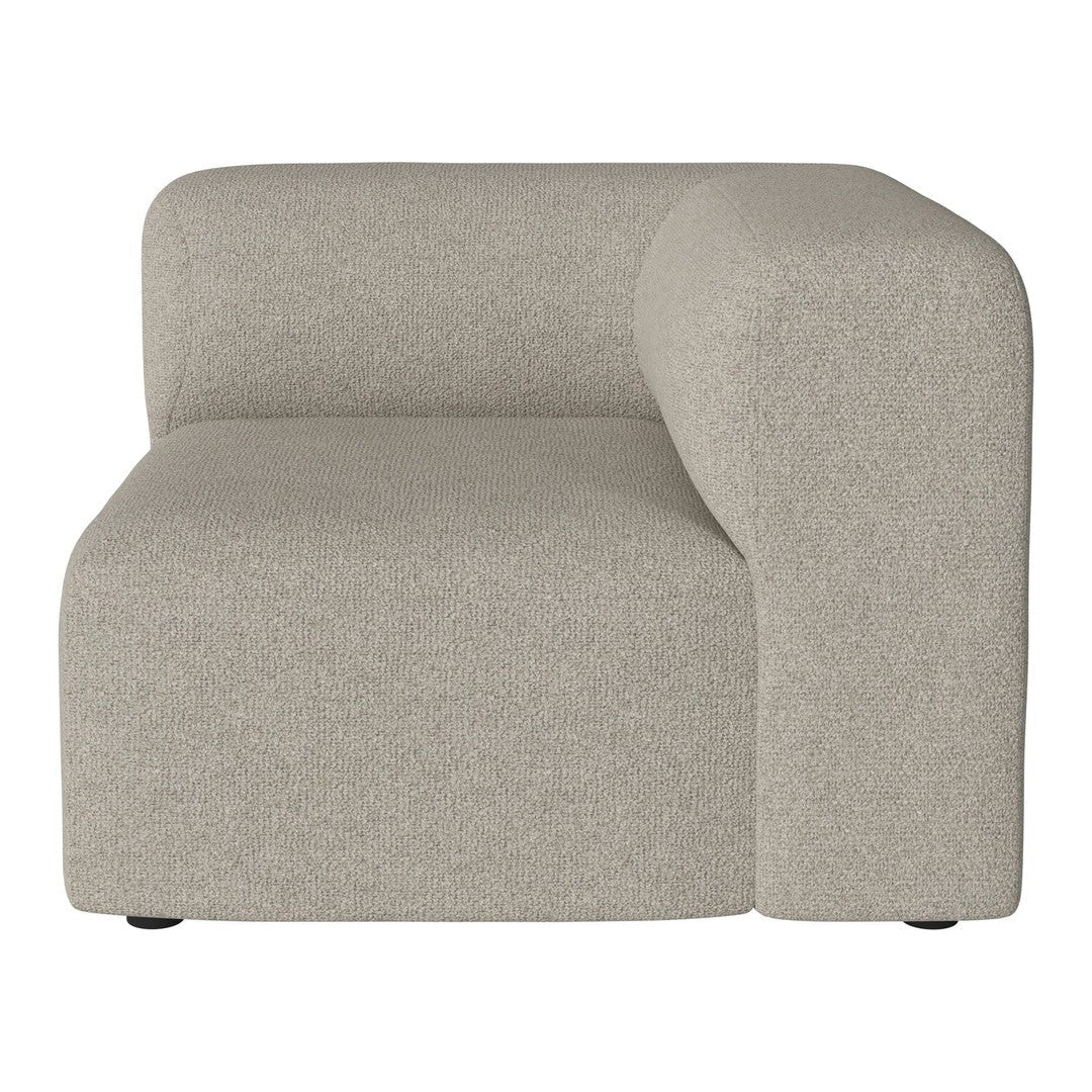 Beige curved sofa section with a smooth, minimalistic texture, perfect for modern interiors.