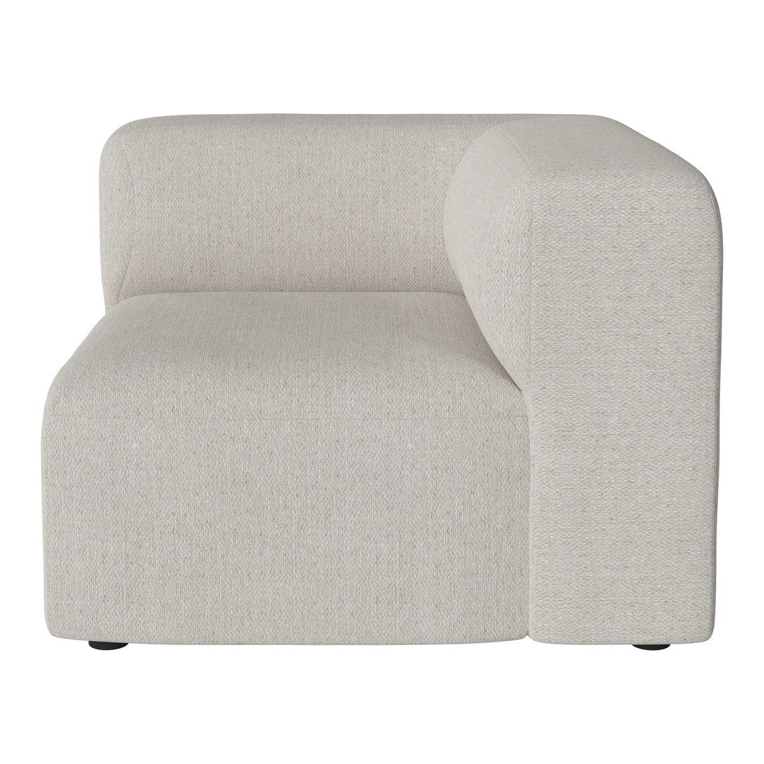 Light beige curved sofa section with a smooth, textured fabric and minimalistic design. Ideal for modern interiors.