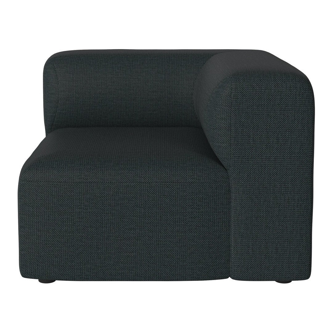 Dark green upholstered corner sofa with a modern, textured pattern. Soft lines and minimalist design.