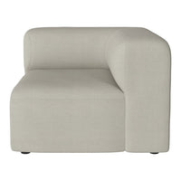 Light beige upholstered corner sofa with a smooth, minimalist design and no visible patterns.