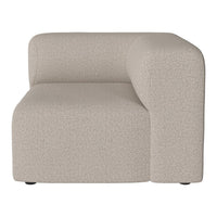 Beige, textured fabric sectional sofa in a modern, minimalist design with a smooth, curved armrest.