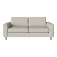 Light beige fabric sofa with clean lines and minimalist design, featuring soft, smooth upholstery and wooden legs.
