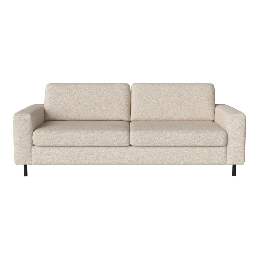 Beige upholstered sofa with a smooth texture and minimalistic design, featuring clean lines and no visible patterns.