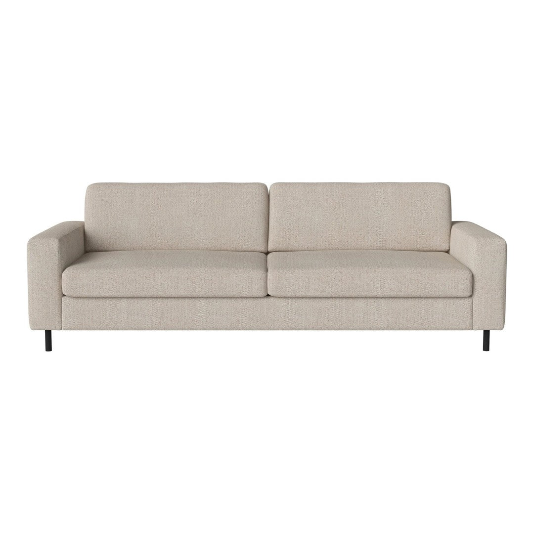 Beige upholstered sofa with a smooth texture and minimalistic design, featuring clean lines and modern style.