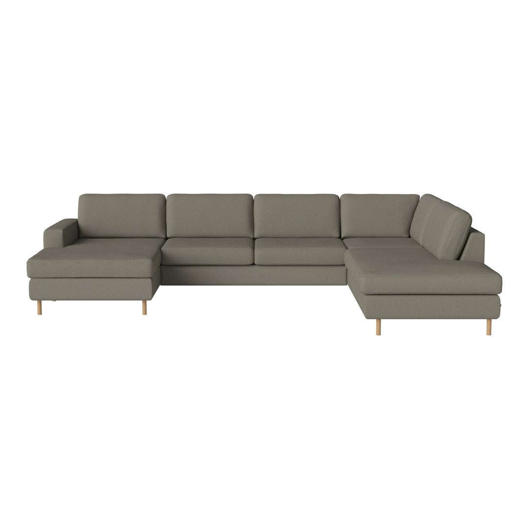 Gray sectional sofa with clean lines and textured upholstery, featuring light wooden legs for a modern touch.