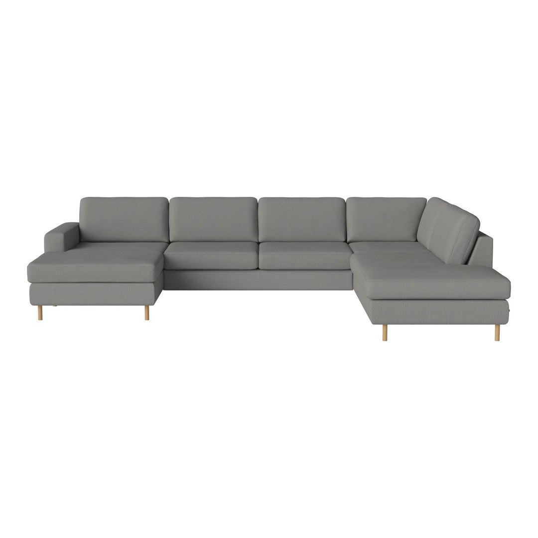 Gray sectional sofa with clean lines and minimalist design, featuring a smooth fabric texture and light wood legs.