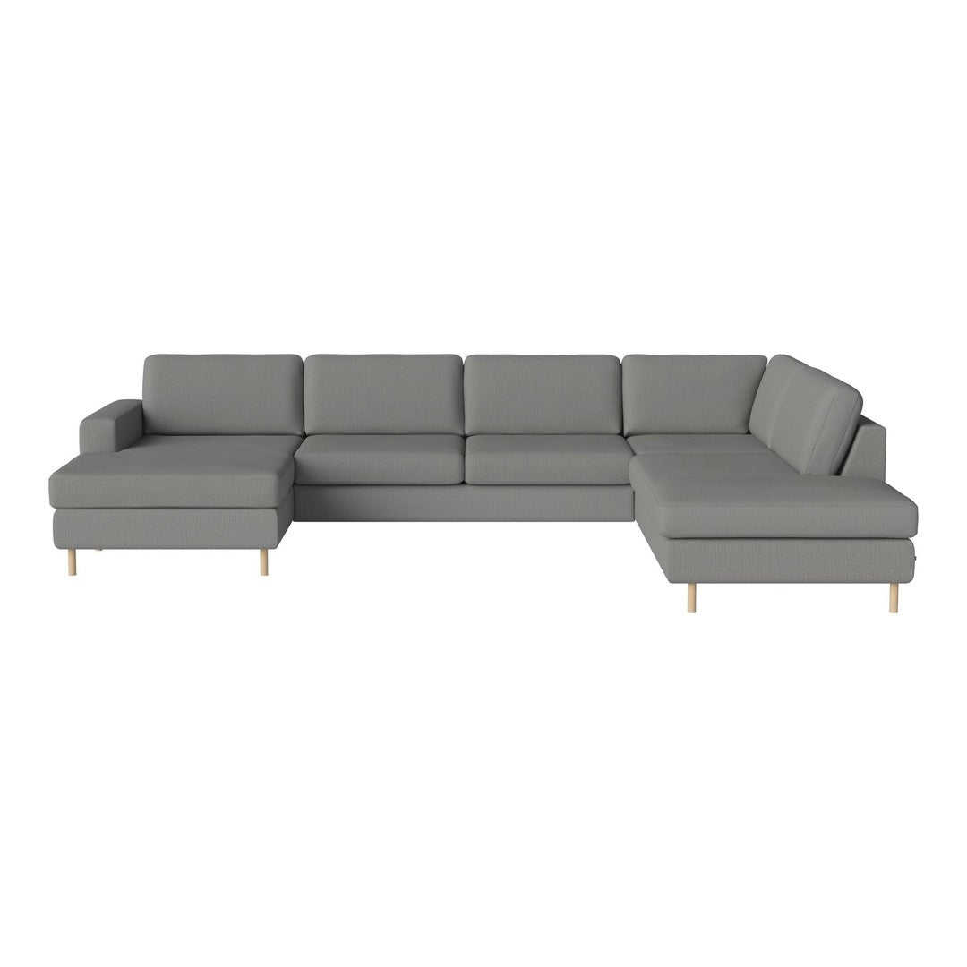Modern gray sectional sofa with clean lines and a minimalist design, featuring light wooden legs.