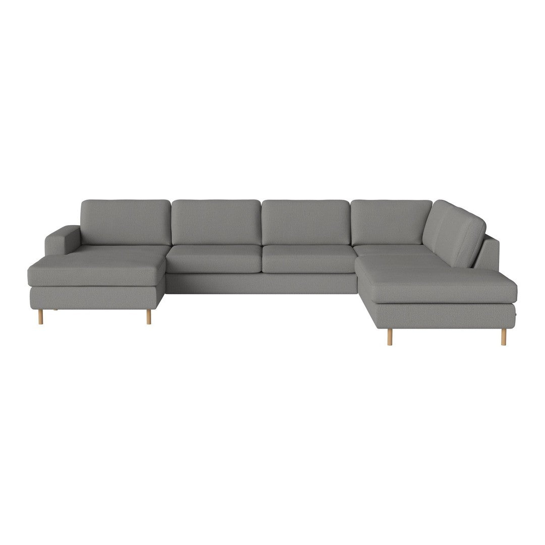 Modern L-shaped sofa in sleek gray fabric with clean lines and minimalist design, featuring light wooden legs.