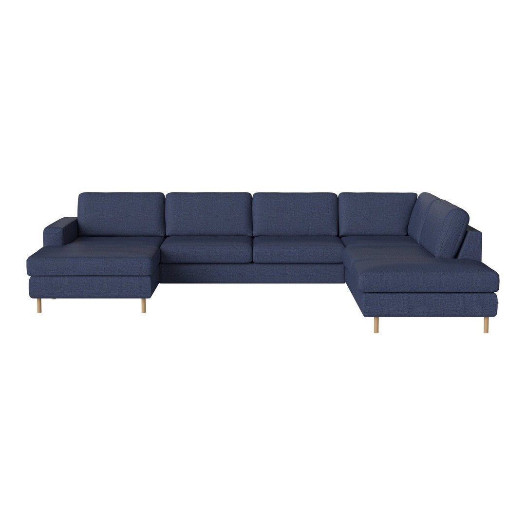 Modern navy blue sectional sofa with a minimalist design and clean lines, featuring solid color upholstery and wooden legs.