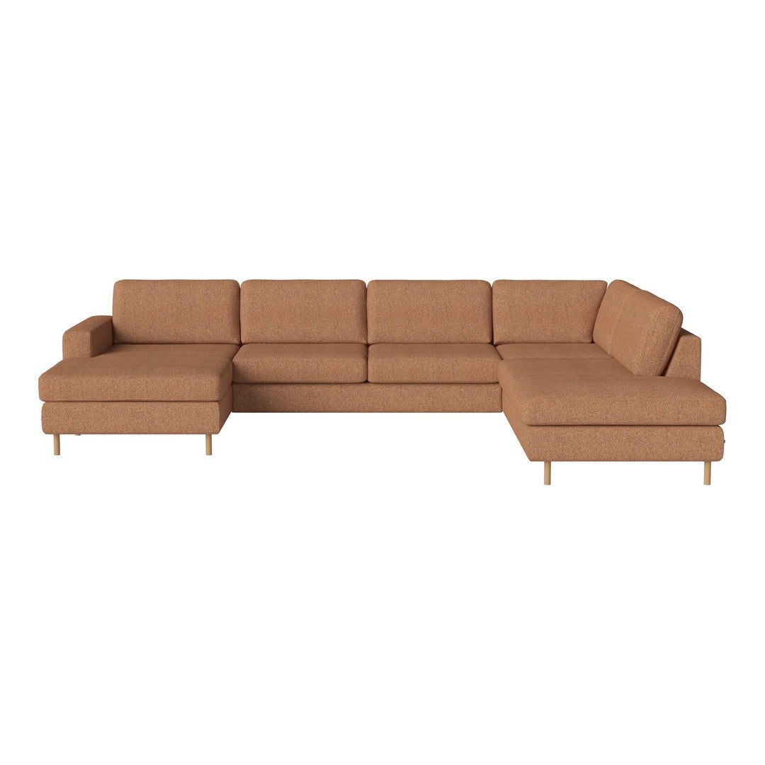 Light brown sectional sofa with a textured fabric and clean lines, featuring a modern design and minimalist style.