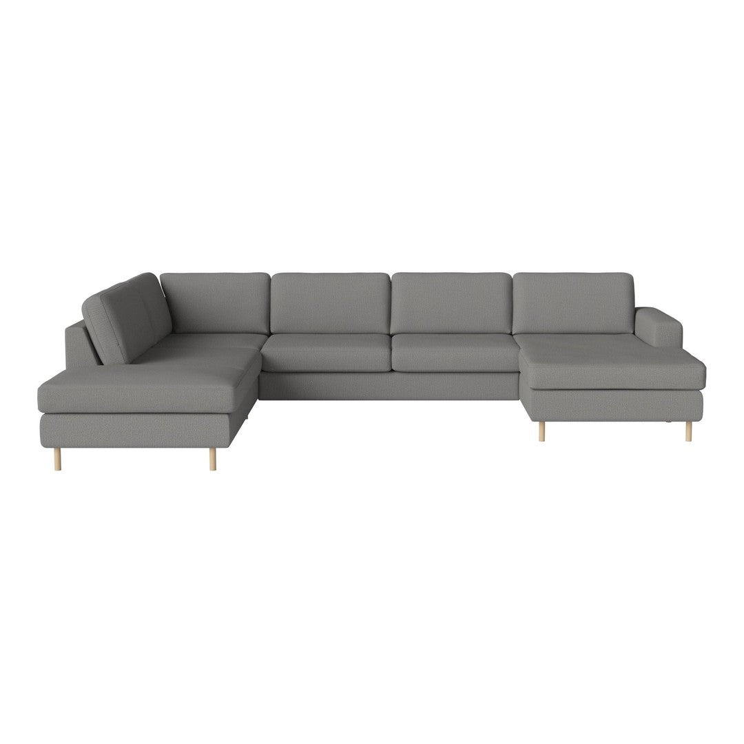 Gray sectional sofa with a minimalist design and clean lines, featuring solid fabric and wooden legs for a modern look.
