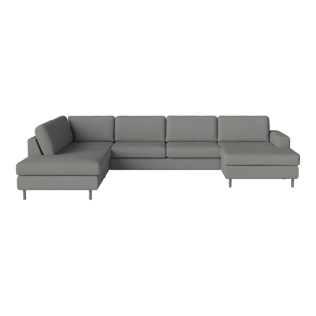 Modern gray sectional sofa with a minimalist design and soft fabric. Perfect for contemporary living spaces.