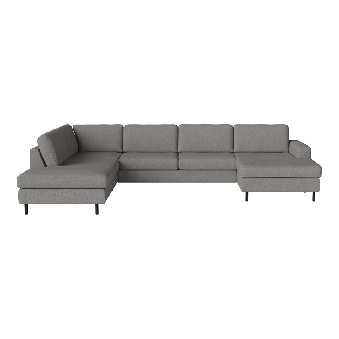 Gray sectional sofa with a modern design, featuring smooth fabric and clean lines for a minimalist look.