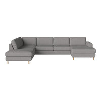 Gray sectional sofa with clean lines and minimalist design, featuring plush cushions and light wooden legs.
