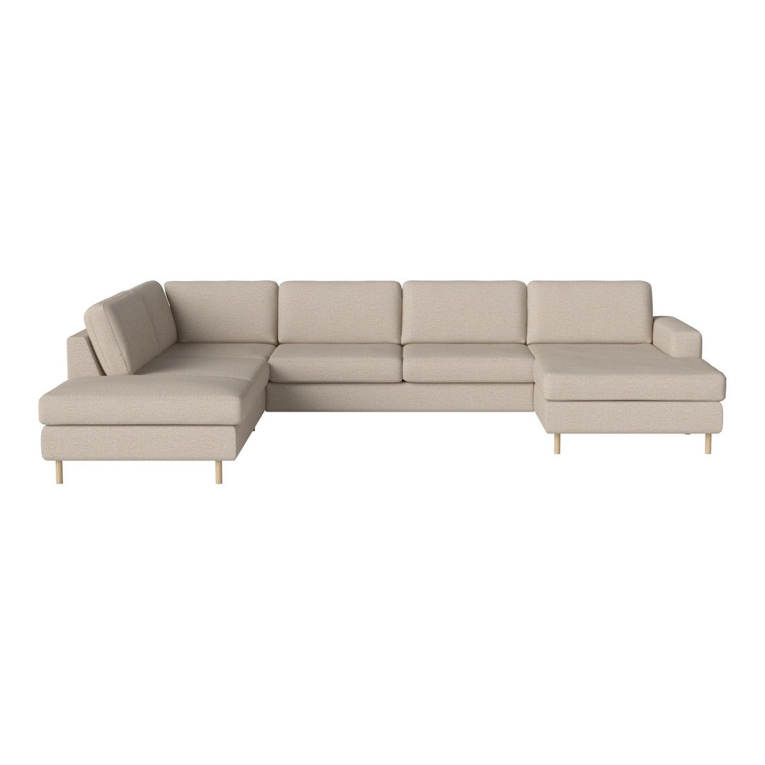 Beige sectional sofa with smooth upholstery and minimalist design, featuring clean lines and wooden legs.