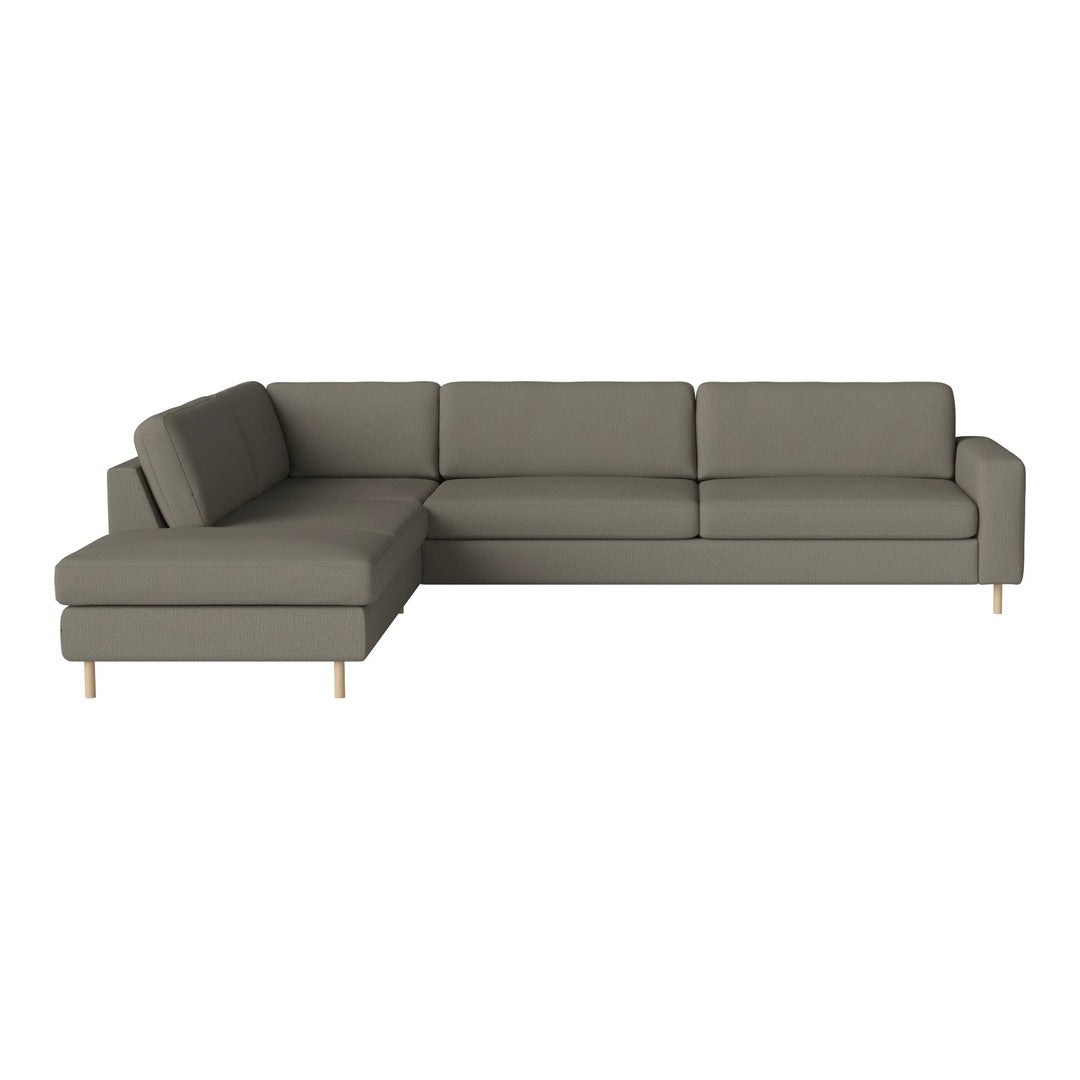 Muted gray sectional sofa with sleek lines and light wood legs, perfect for modern living spaces.